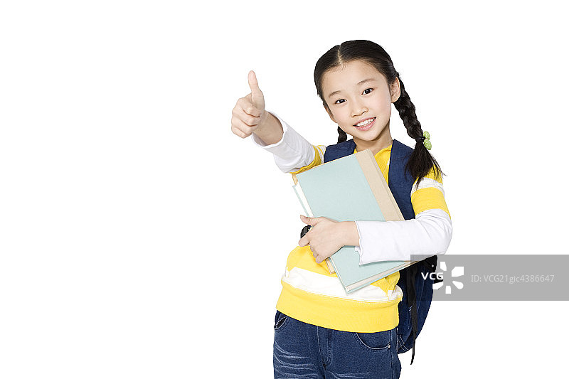 小女孩抱着图书图片素材
