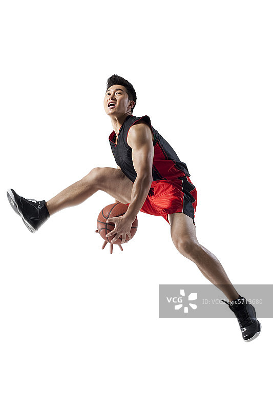 篮球运动员胯下传球图片素材