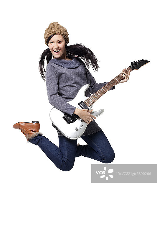 时尚青年女子和电吉他图片素材