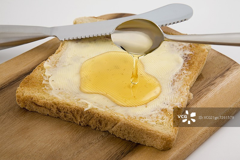 涂蜂蜜的烤面包图片素材