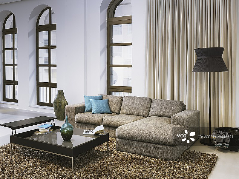 豪华的客厅，落地窗前摆放着沙发和黑色咖啡桌图片素材