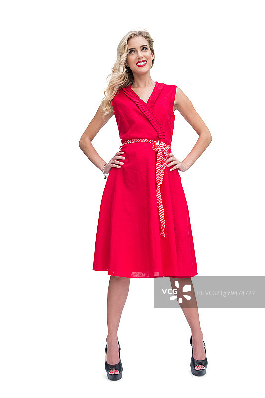 幸福迷人的金发在白色的背景摆姿势图片素材