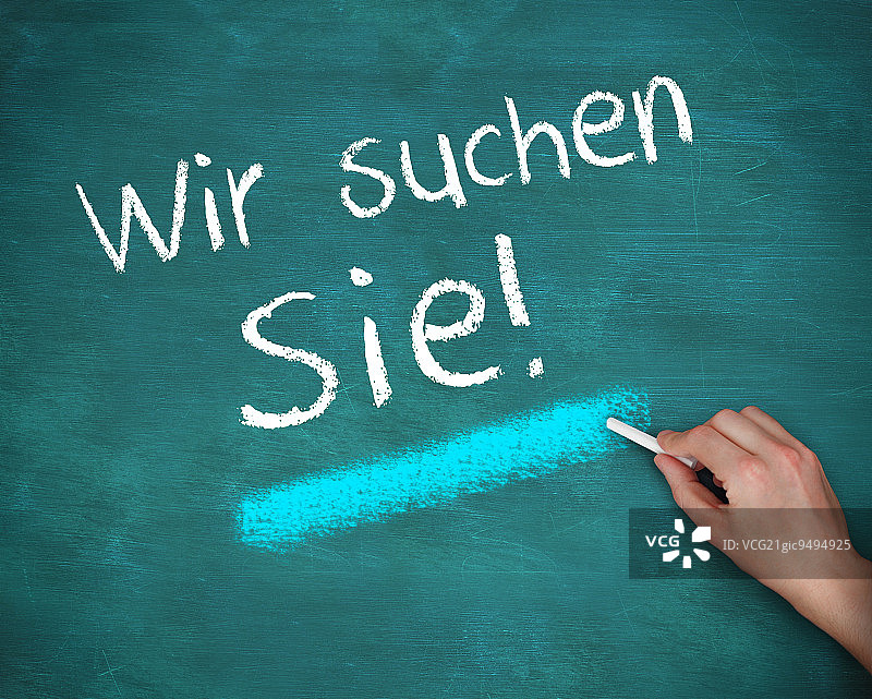 蓝色背景上手写wir suchen sie图片素材