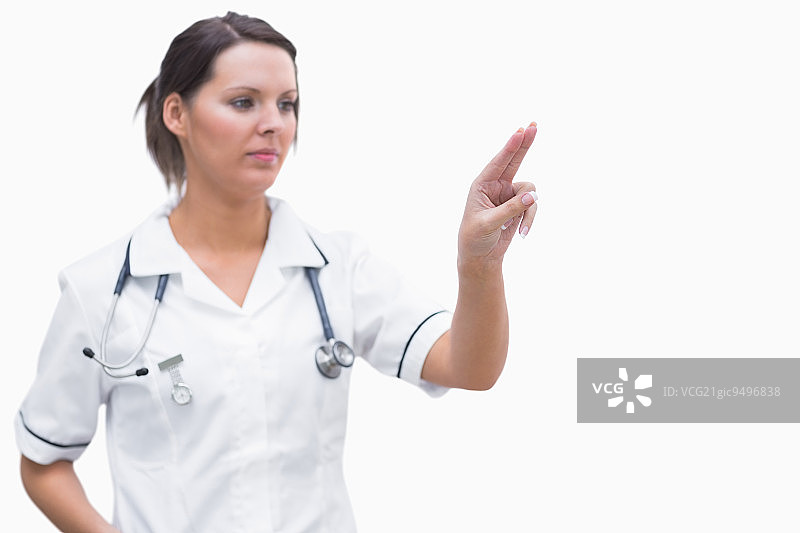 指向隐形屏幕的女护士 портрет图片素材