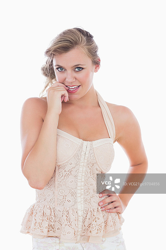 穿着婚纱咬指甲的女人图片素材