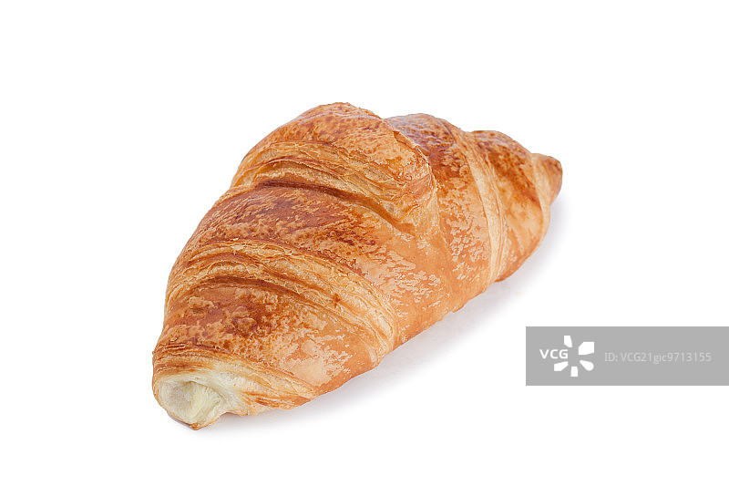 白色背景下的金色牛角面包图片素材