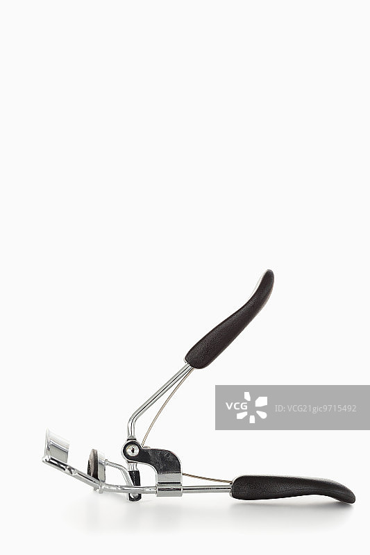 白色背景上的黑色金属卷发器图片素材