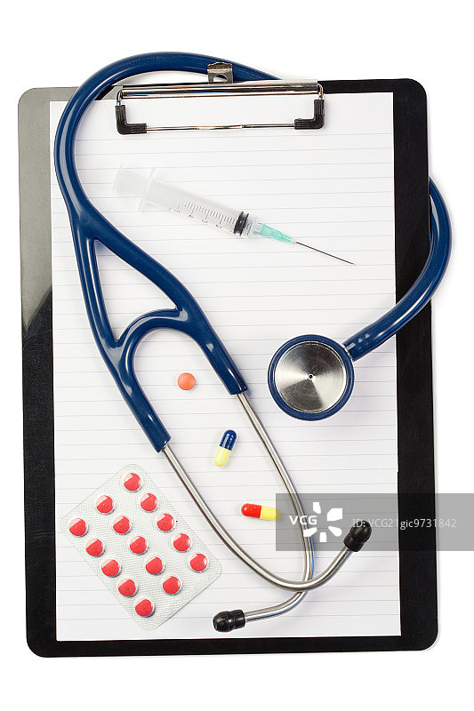 白色背景上的笔记本、听诊器、胶囊和注射器图片素材