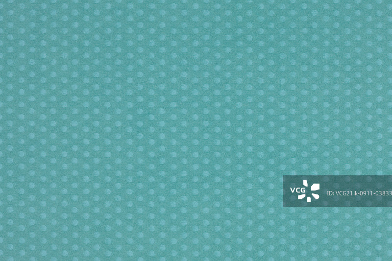 绿色背景上的波点图片素材