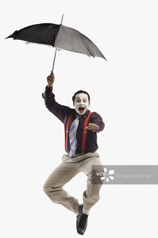 哑剧：摔倒的雨伞图片素材