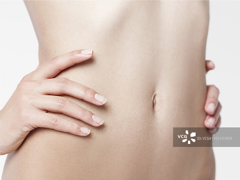 手抚摸肚子图片素材