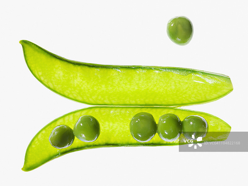 从豌豆荚中分离出的豌豆图片素材