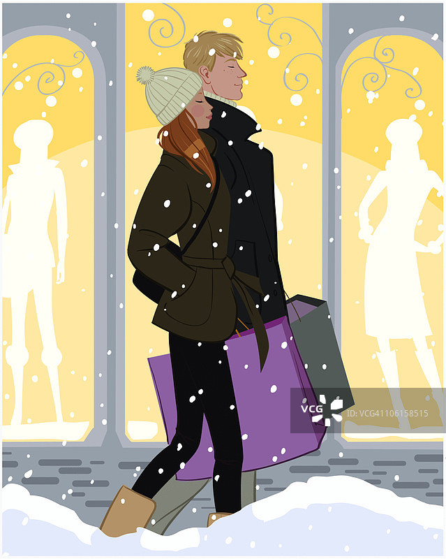 下雪天，男人和女人提着购物袋图片素材