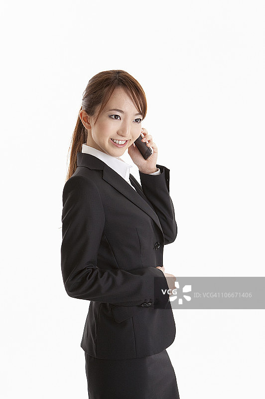 女商人用智能手机交谈图片素材