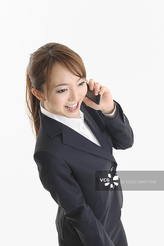 女商人用智能手机交谈图片素材