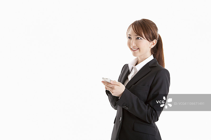 触摸智能手机的女商人图片素材