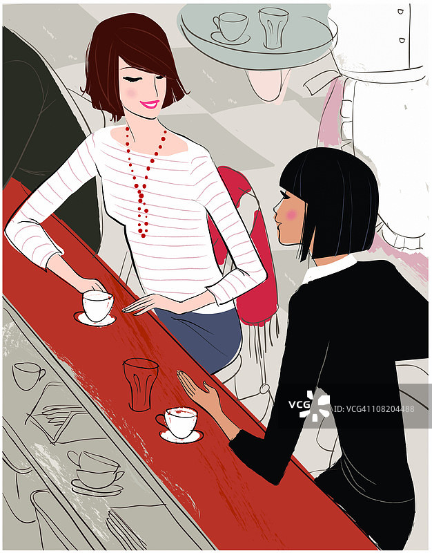 两个女人在餐厅柜台聊天图片素材