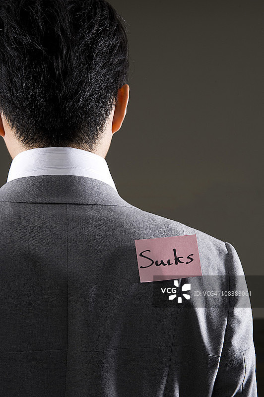 在商人背上贴标签图片素材