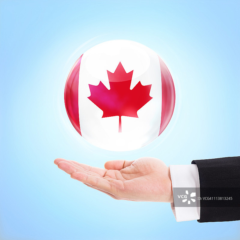 手托举加拿大国旗图片素材