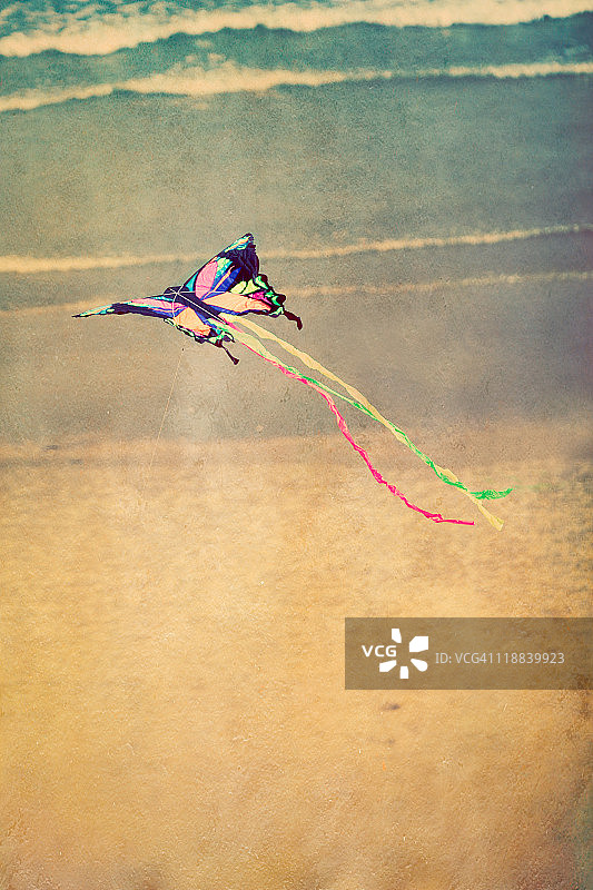 沙滩海洋上的蝴蝶风筝图片素材