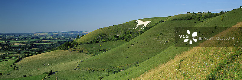 威尔特郡乡村的韦斯特伯里白马和皮尤西谷风光图片素材