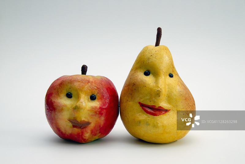 纸质苹果和梨子人脸图案图片素材