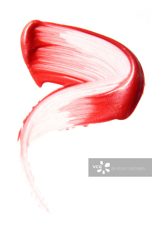 白色背景上的红色唇彩图片素材