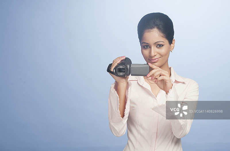 用数码摄像机拍摄的职业女性图片素材