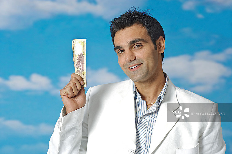 商人手持纸币图片素材