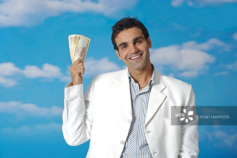 商人手持纸币图片素材