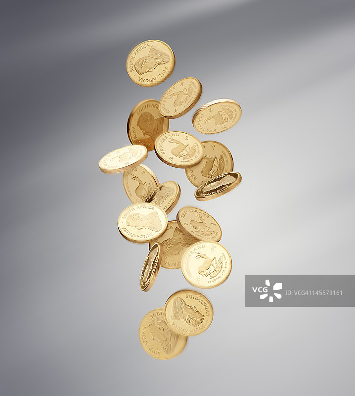 灰色背景上的金币掉落图片素材