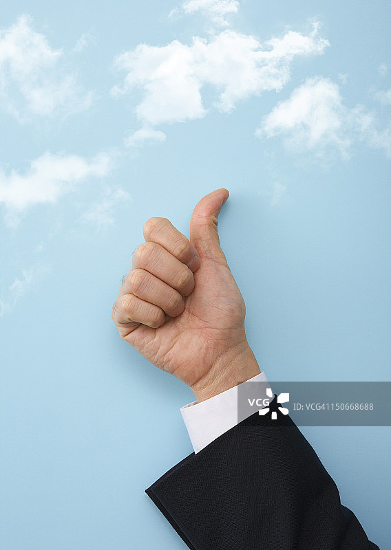 商人竖起大拇指图片素材