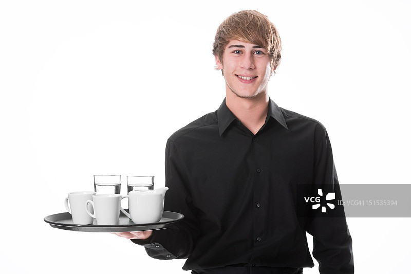 端饮料的年轻服务员图片素材