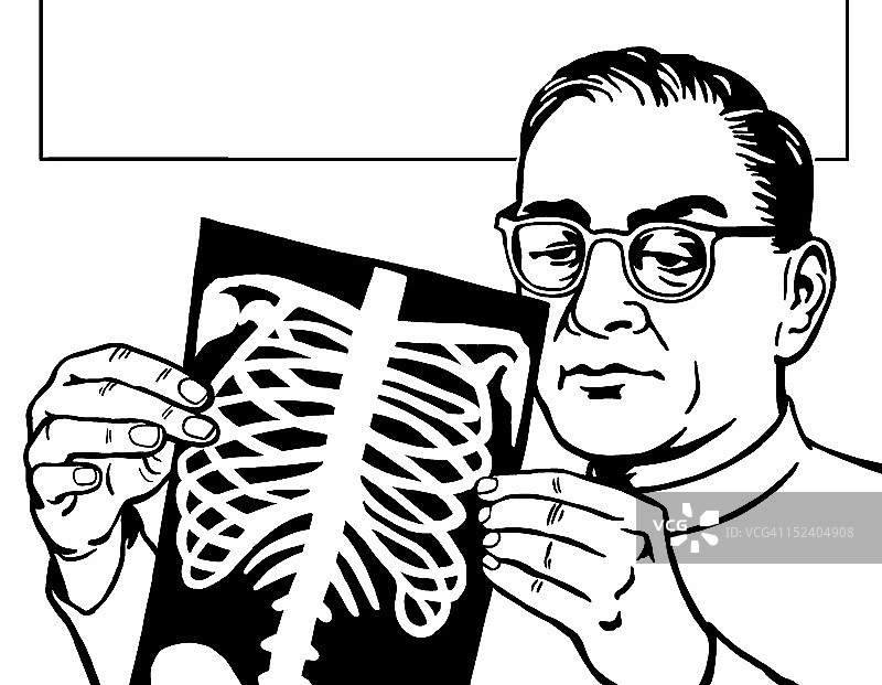 男人看着X光片图片素材