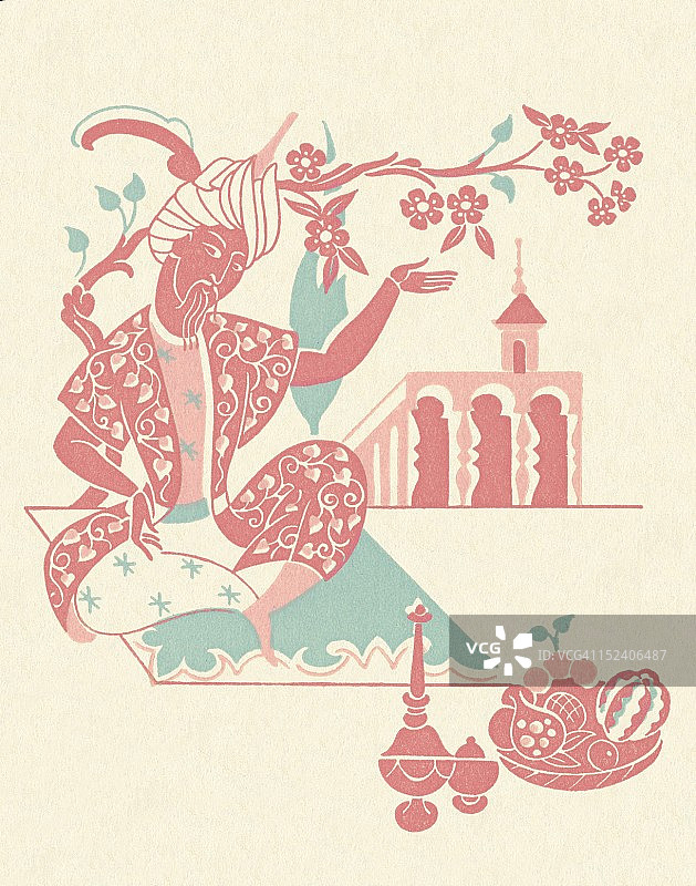 戴头巾的男人坐在地毯上图片素材