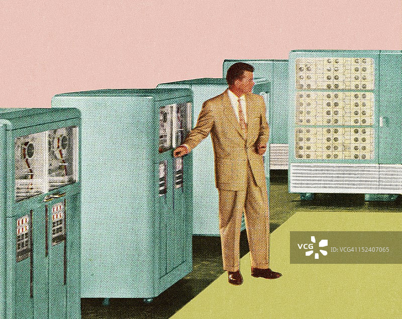 站在办公设备旁的男人图片素材