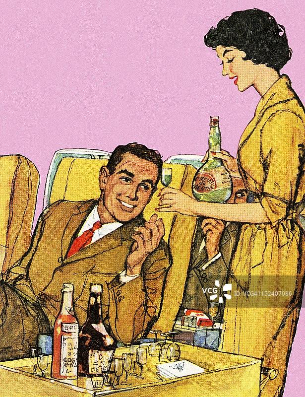 空姐在飞机上提供饮品图片素材