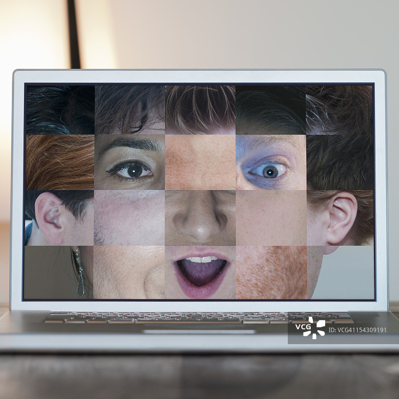 笔记本电脑屏幕显示的面部特写图片素材
