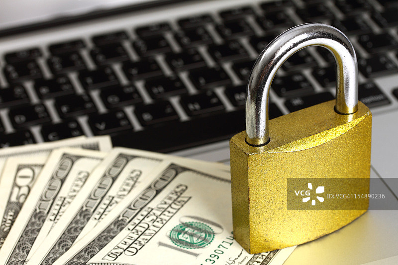 笔记本电脑上的带美元的挂锁图片素材