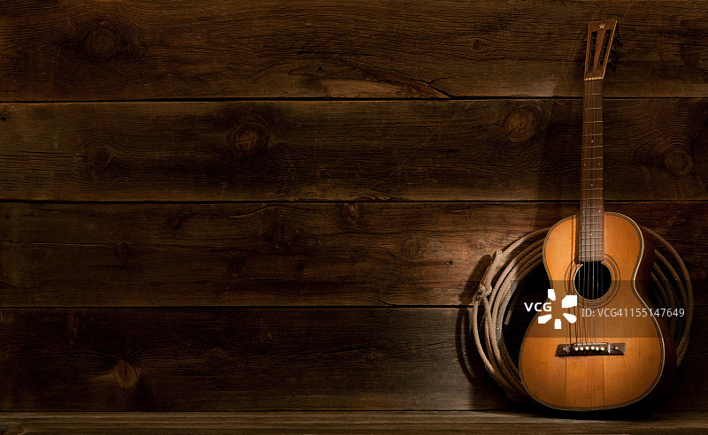 带有客厅吉他和套索的西部谷仓木背景图片素材