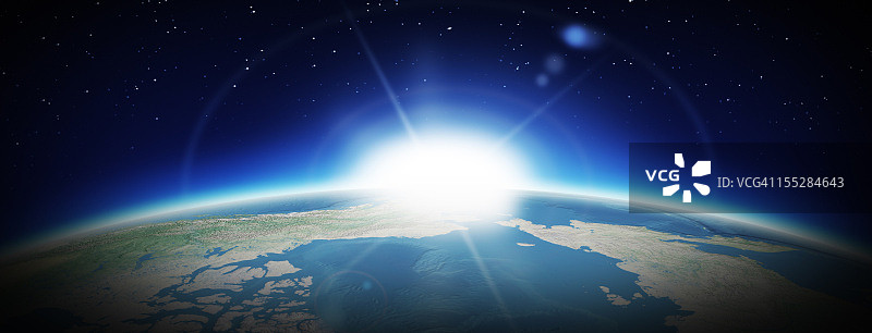 地球与冉冉升起的太阳图片素材