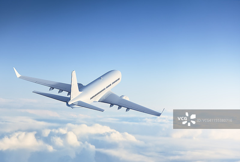 飞越云层的商用喷气机图片素材