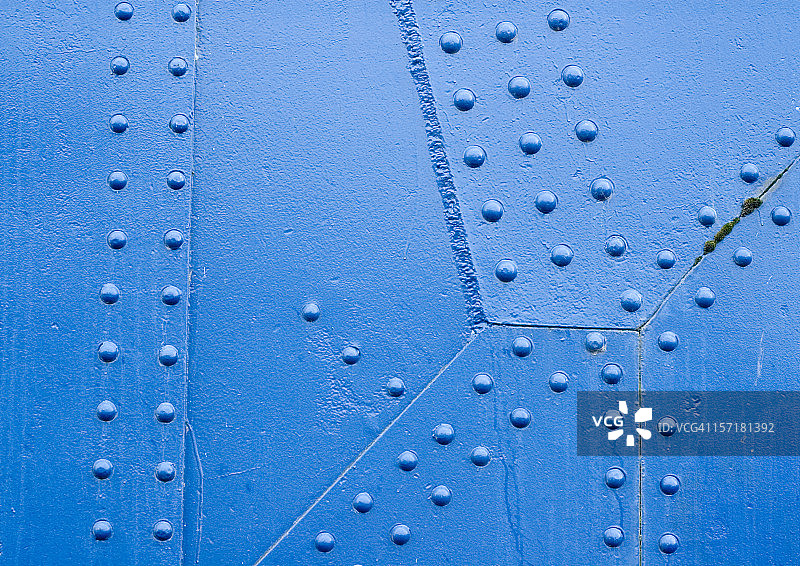 蓝色铆钉表面图片素材