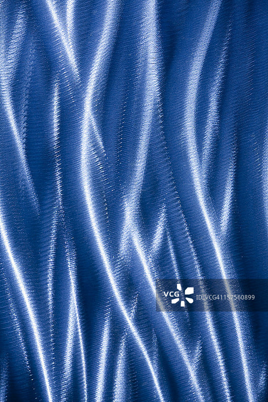 光线反射在拉丝不锈钢上图片素材