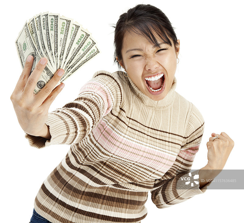 兴奋的年轻女子拿着钱图片素材