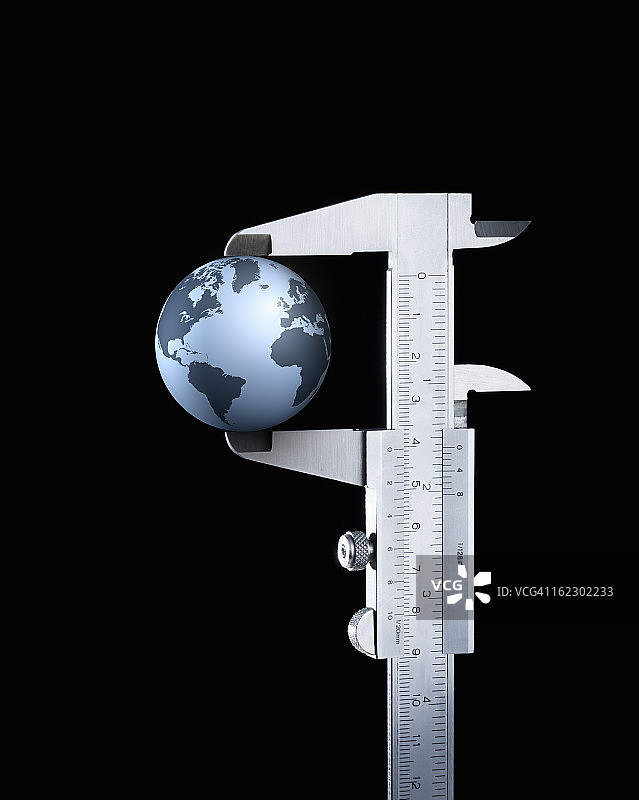 游标卡尺中的地球图片素材