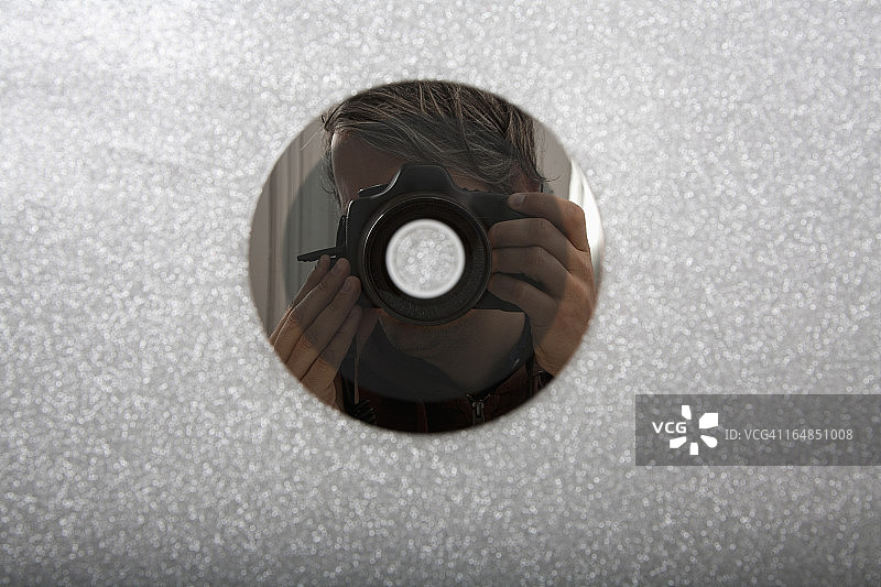 CD反射的摄影师图片素材