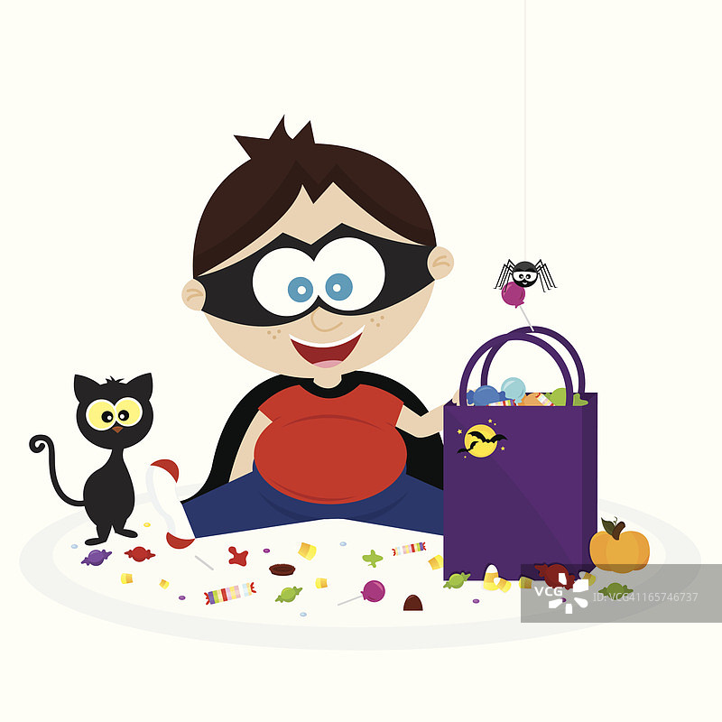 快乐的小男孩和他的万圣节糖果！图片素材