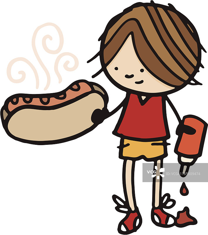 小男孩拿着一个大热狗和番茄酱图片素材
