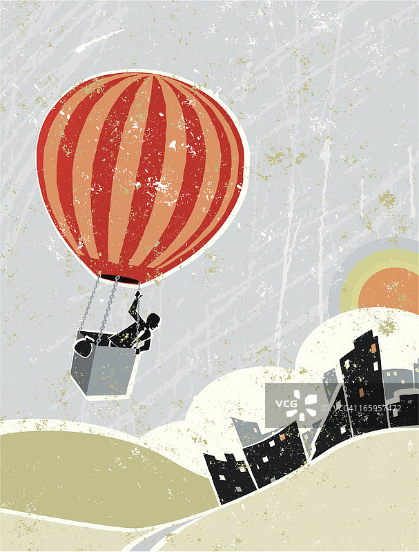 乘坐热气球飞越城市景观的商务男人图片素材